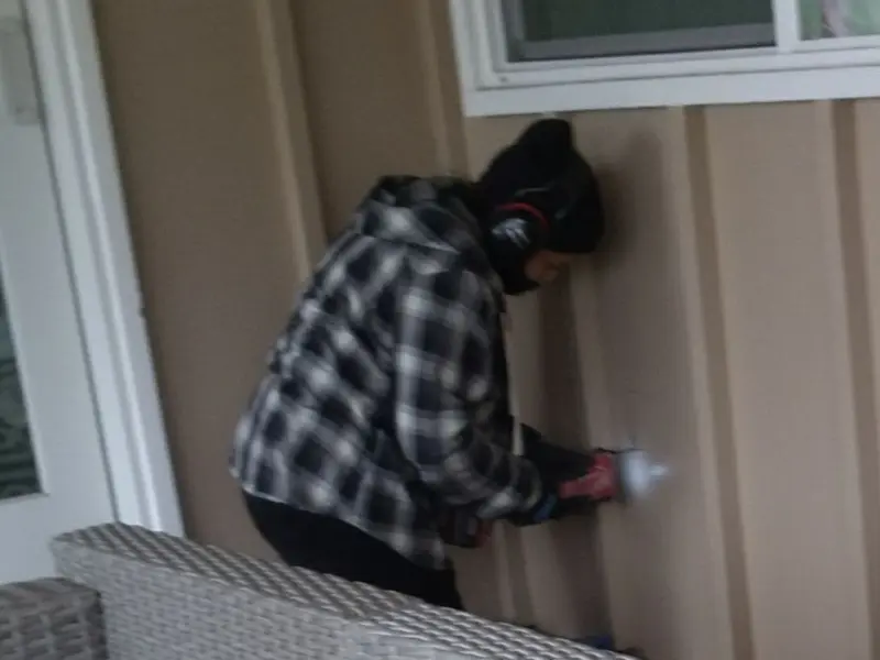 Professional electrician installing an exterior outlet in Trenton